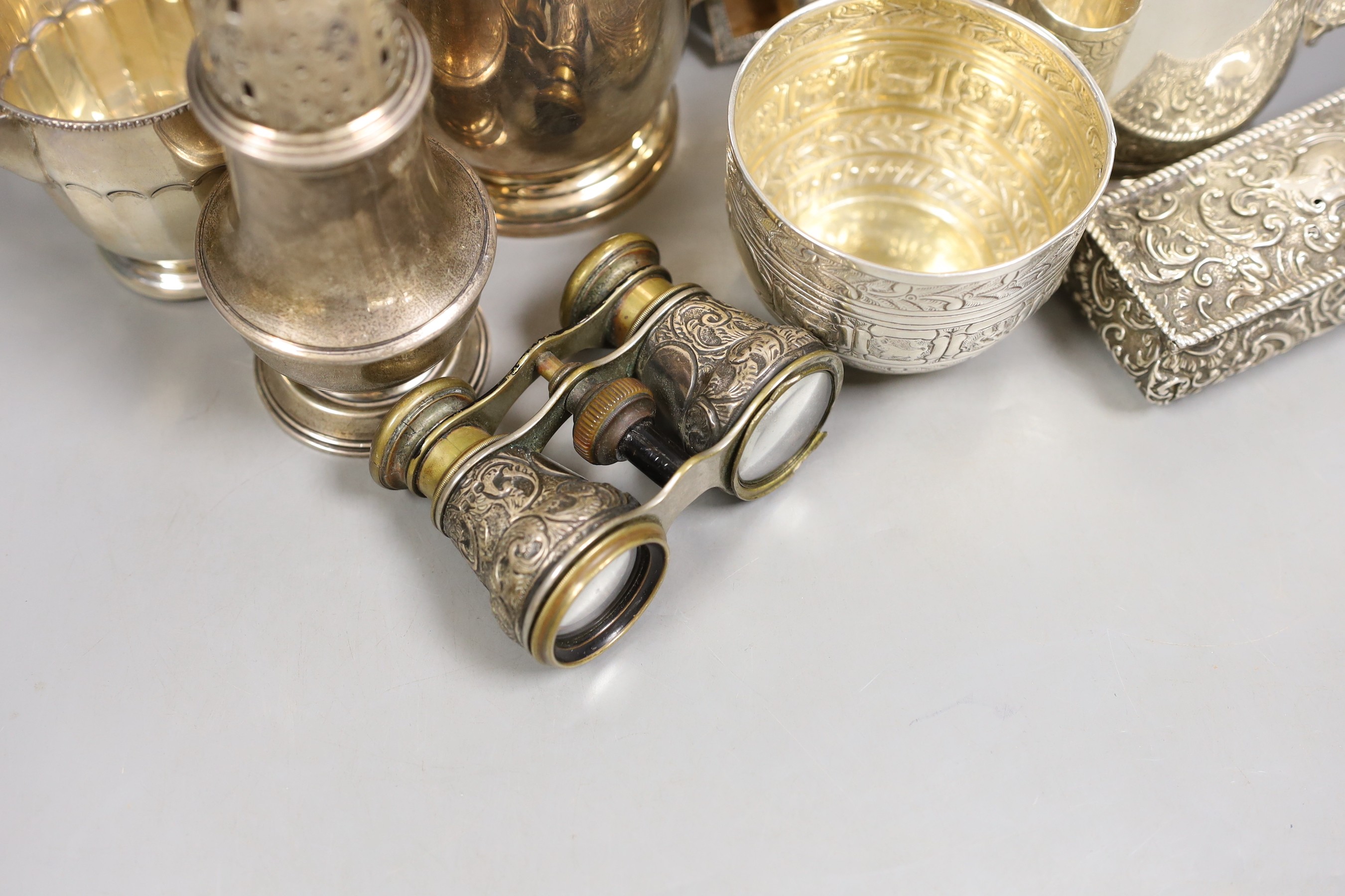 A George V silver coffee pot, London, Carrington & Co 1933, an earlier silver mug by Elkington & Co, a silver sugar caster, cream jug and sugar bowl, a repousse box, pair of silver mounted opera glasses and two plated fr